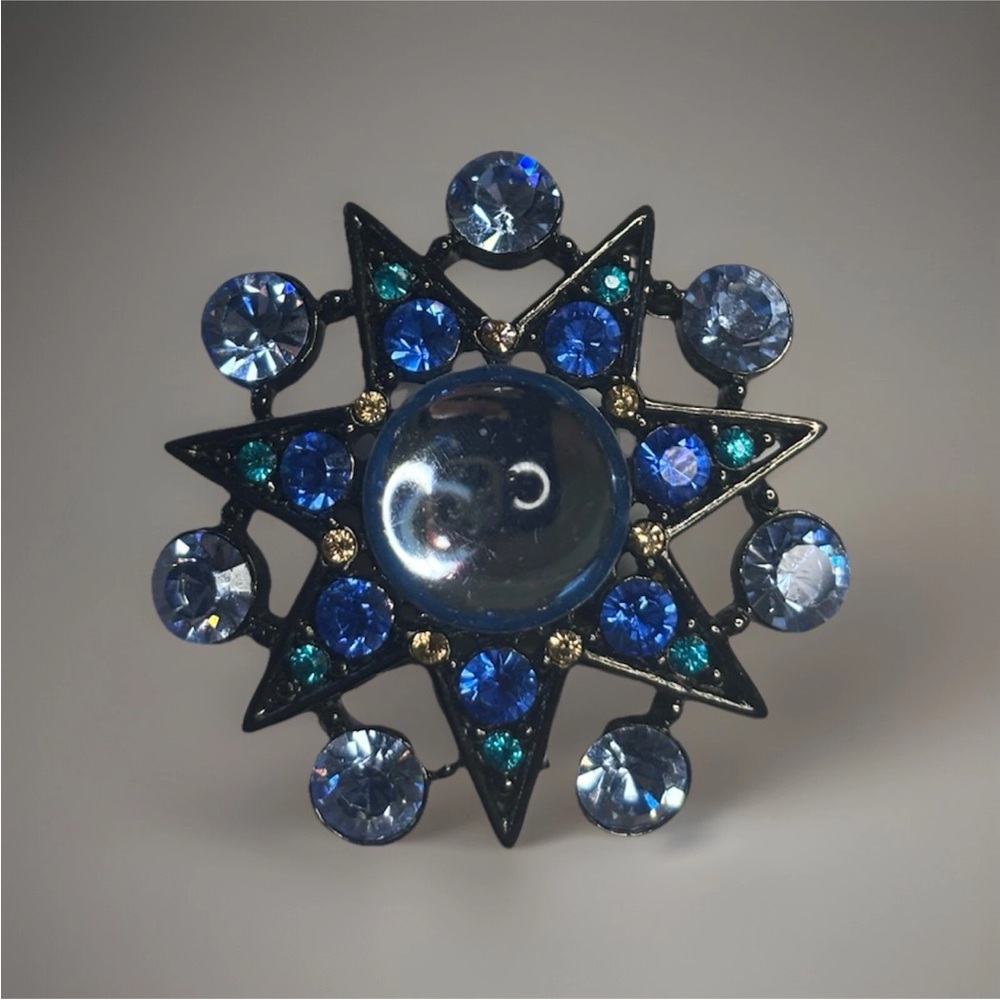 Elegant Blue and Gold Starburst Brooch